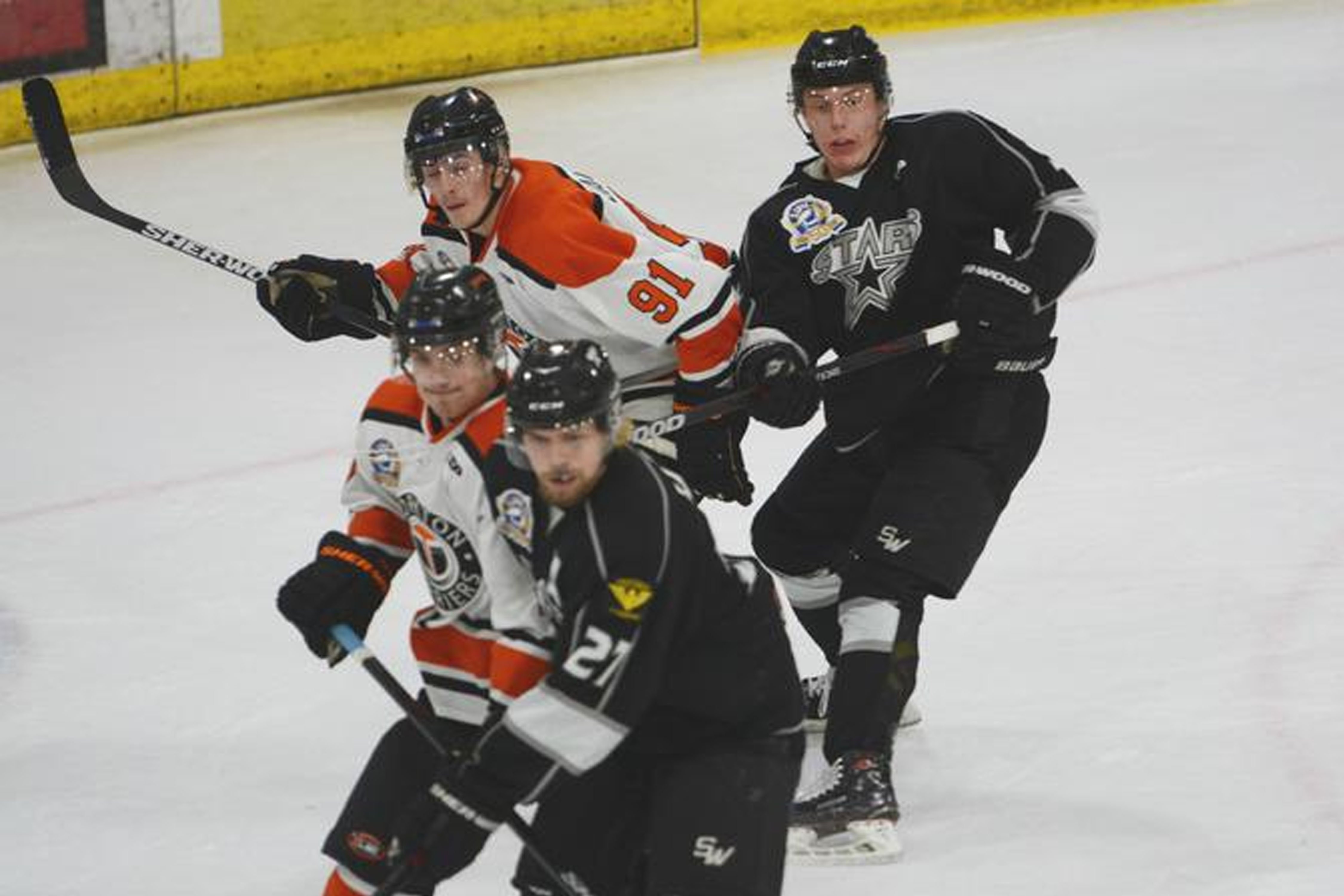 People playing hockey